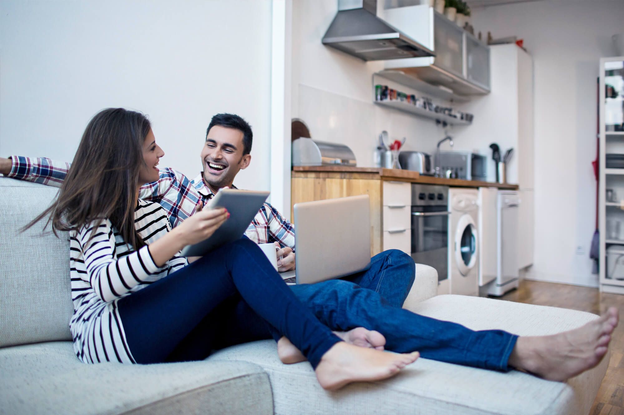 Young Couple Sitting on Couch