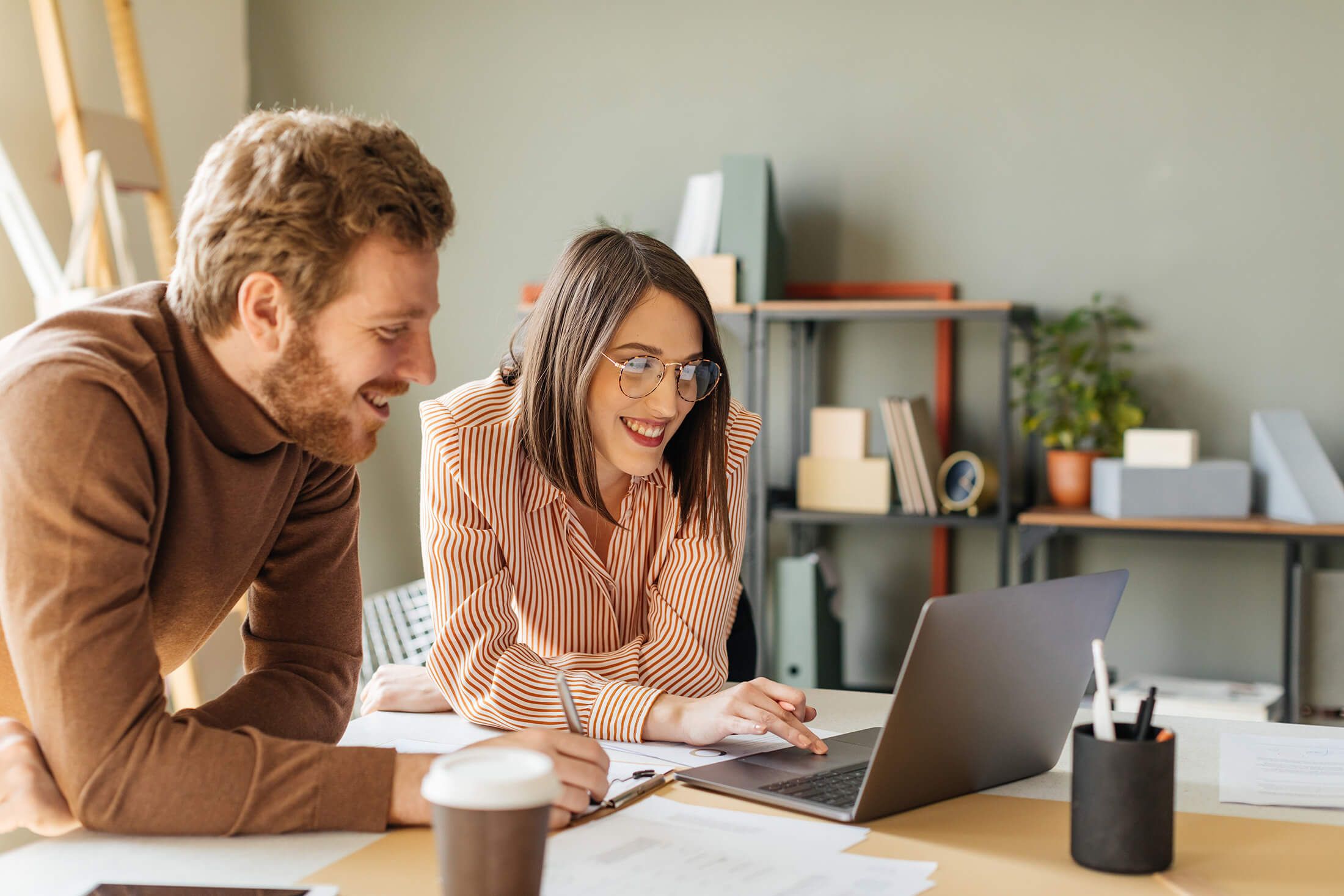 two people looking at computer