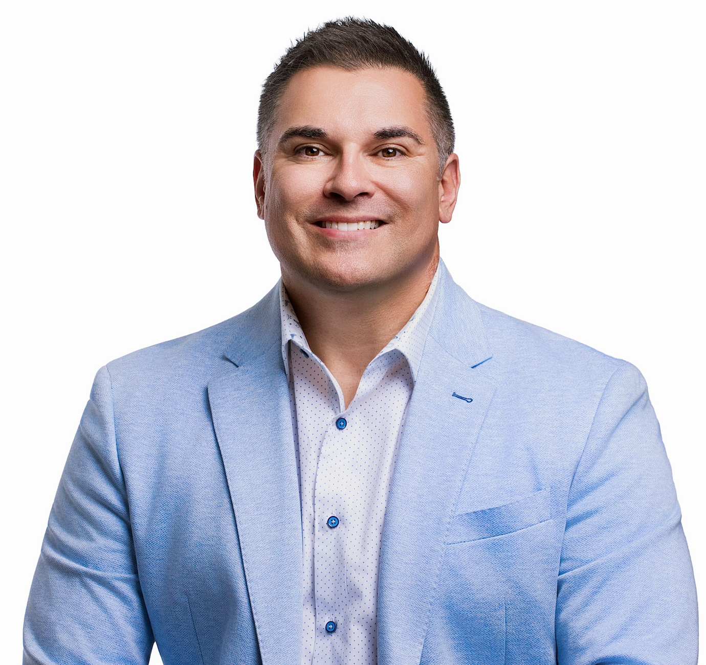 Professional businessman smiling in a gray suit and red tie, indoor office setting
