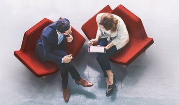 aerial two people sitting in chairs