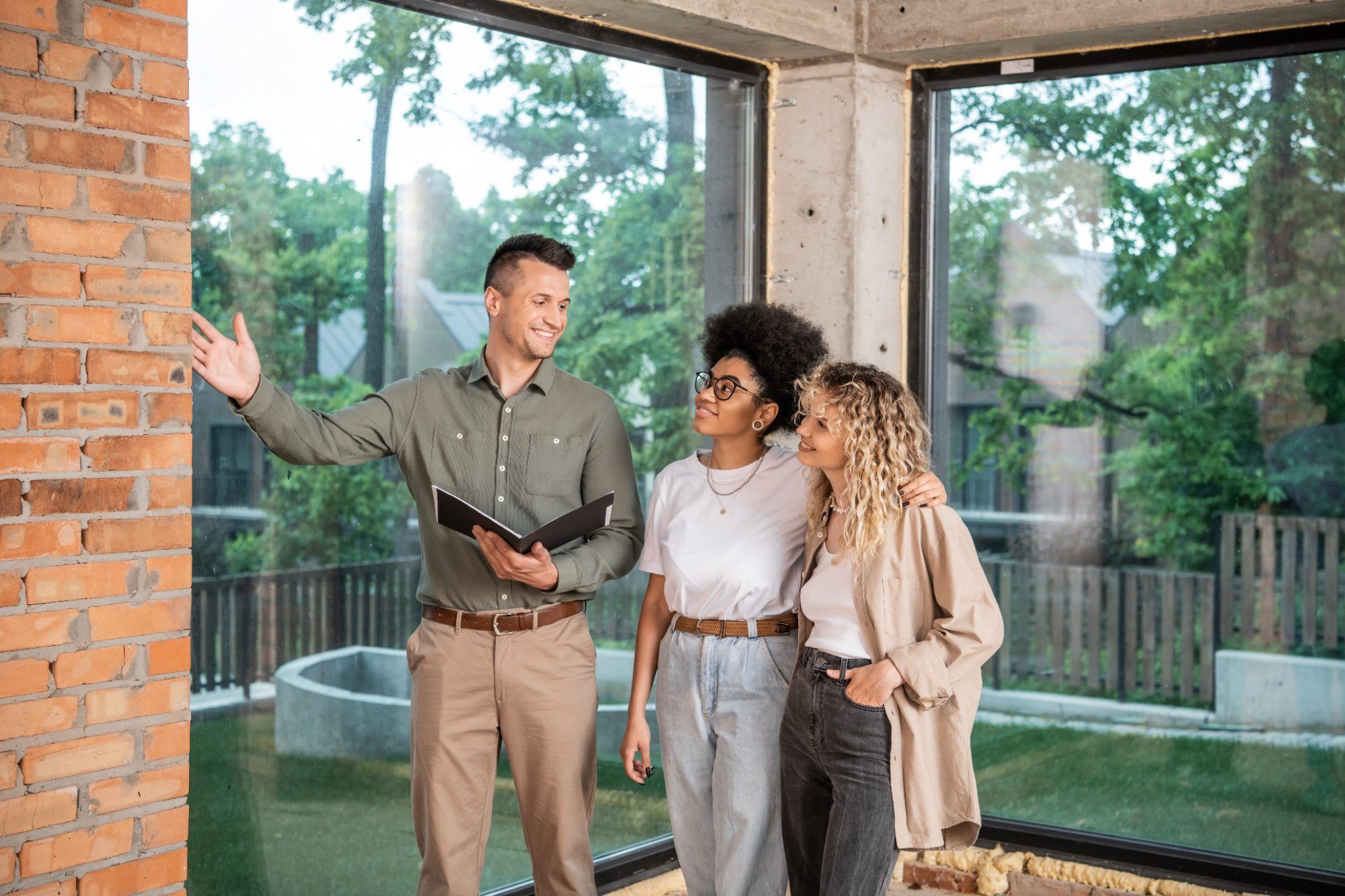 Real estate agent showing a home to a couple