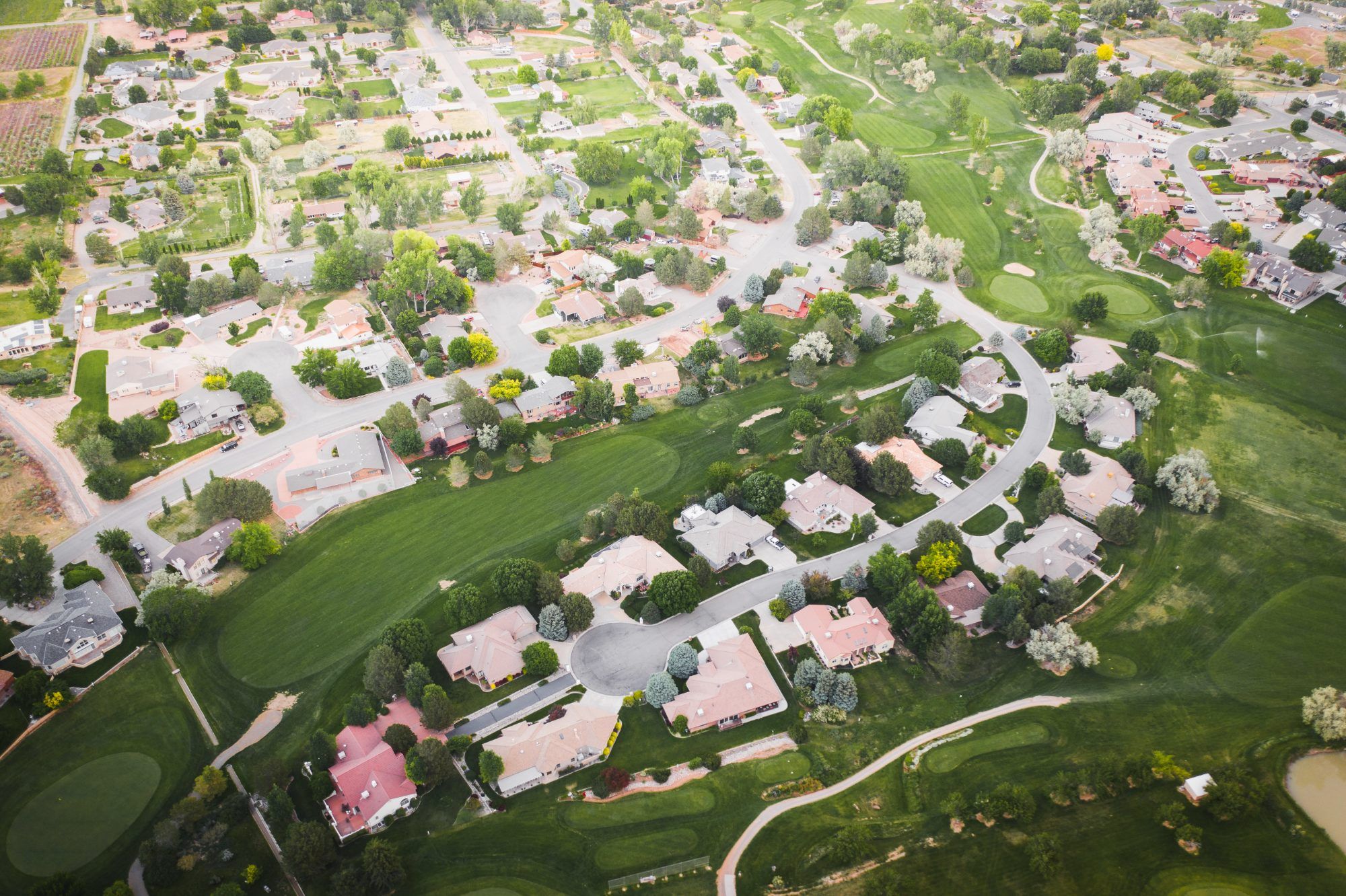 Aerial view of homes and green space