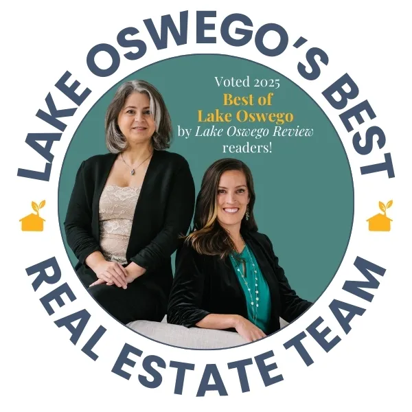 Lake Oswego's Best Real Estate Team award by Lake Oswego Review readers in 2025 featuring two female real estate agents smiling and sitting together.