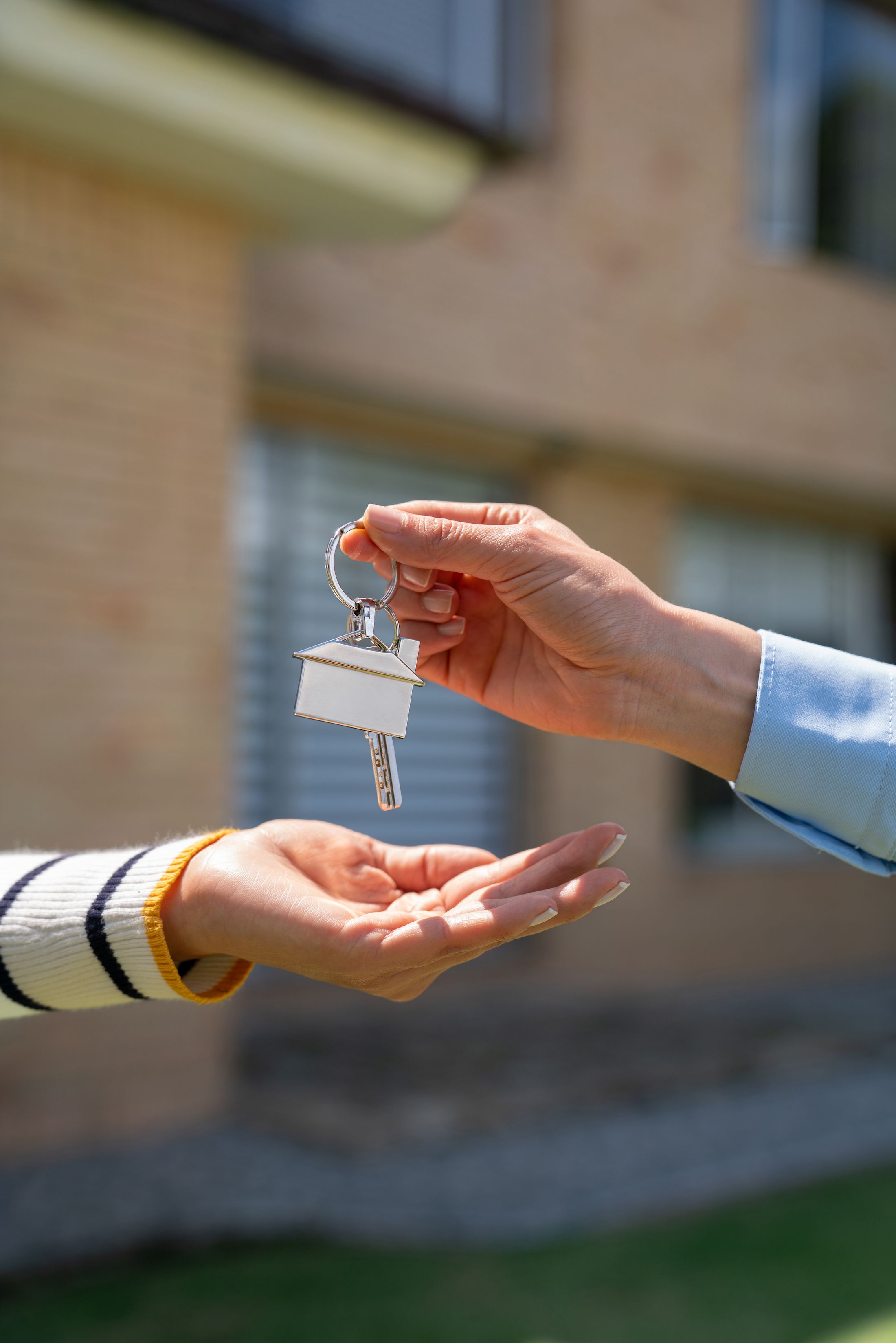 Real estate listings displayed on a computer and mobile device screens featuring various houses for sale with images, prices, and property details.