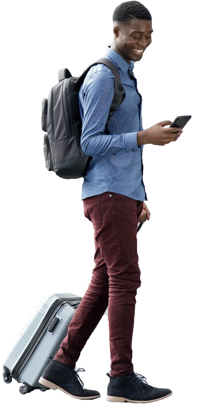 Young man traveling with a backpack and rolling suitcase, using smartphone, dressed in casual attire, isolated on white background