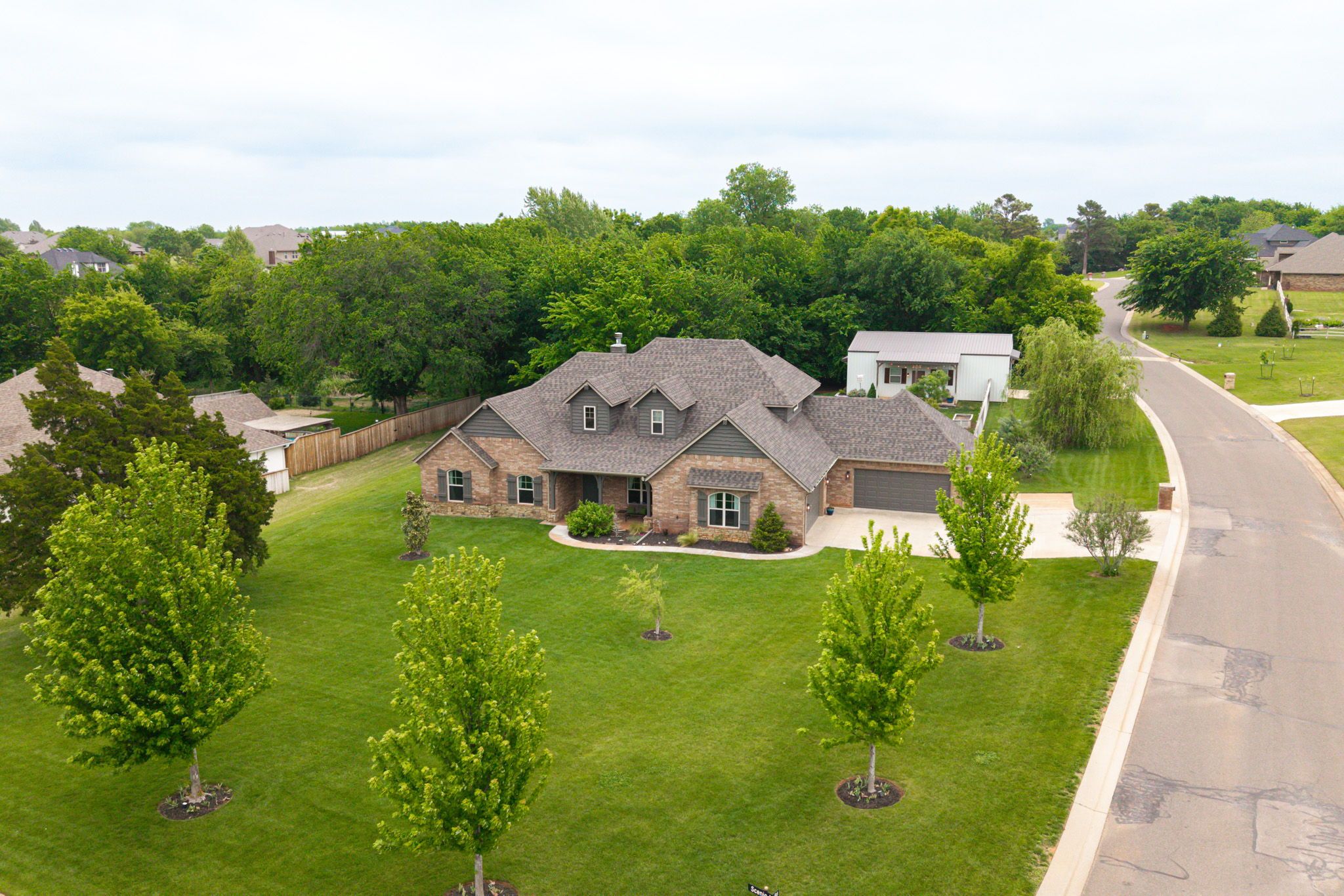 Treed acreage and backyard at 10430 Pine Ridge Road in Edmond Oklahoma