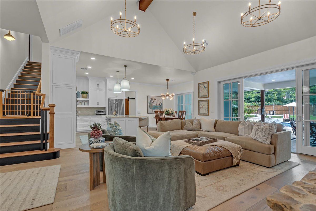 Open-concept custom luxury interior with kitchen and living room at 4311 N Peniel Avenue in Bethany