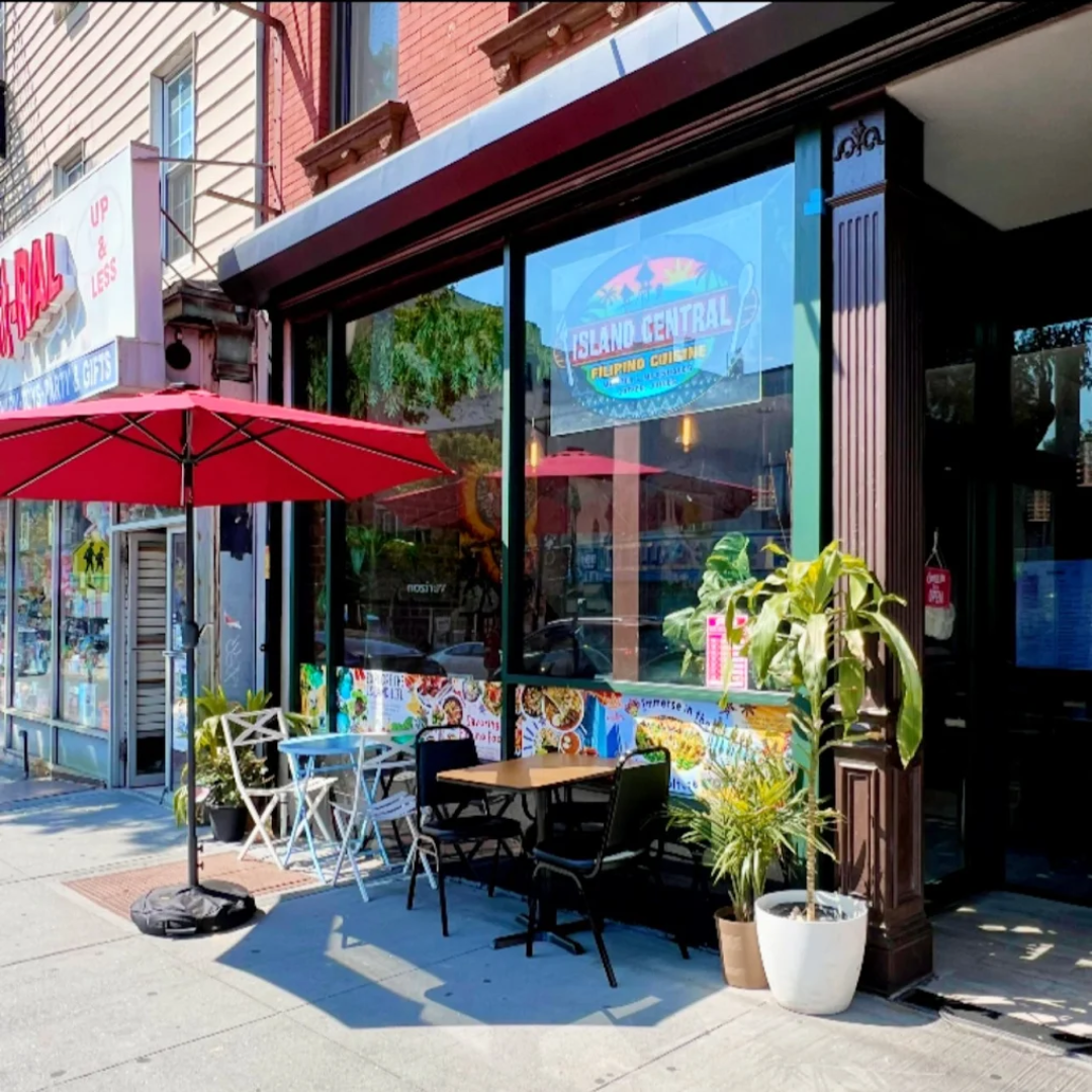 Front view of Sicilian Guy Italian Sandwiches storefront with a black 