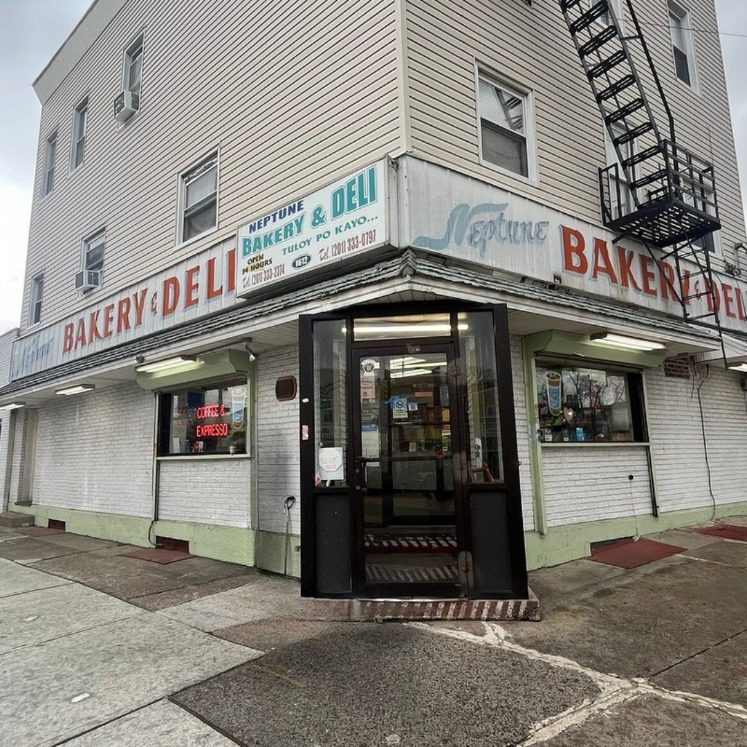 Front view of Sicilian Guy Italian Sandwiches storefront with a black 