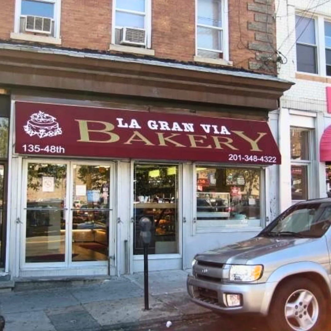 Front view of Sicilian Guy Italian Sandwiches storefront with a black 