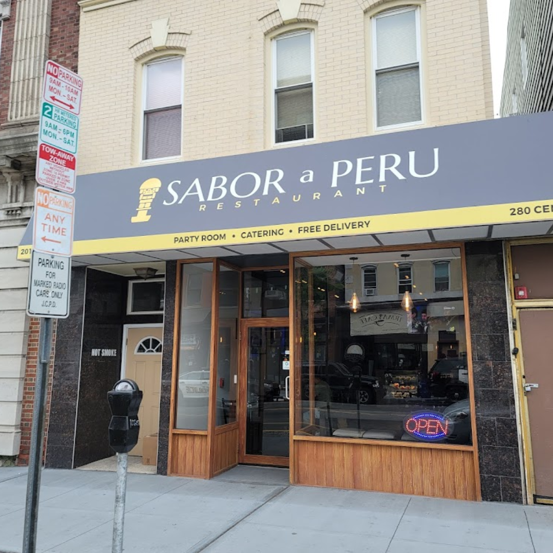 Peruvian restaurant Sabor a Peru with outdoor seating, neon 