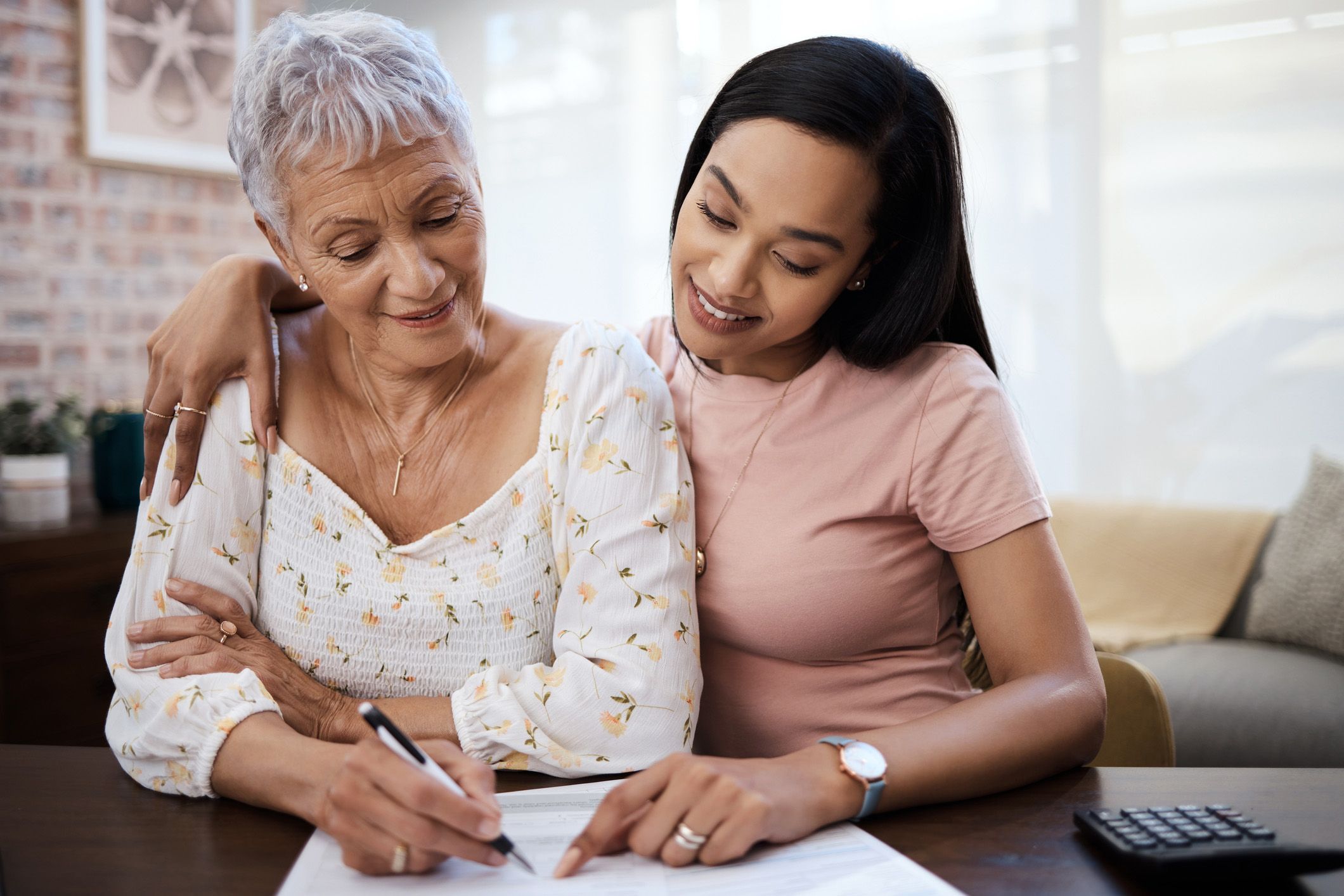 mother and daughter reviewing finances
