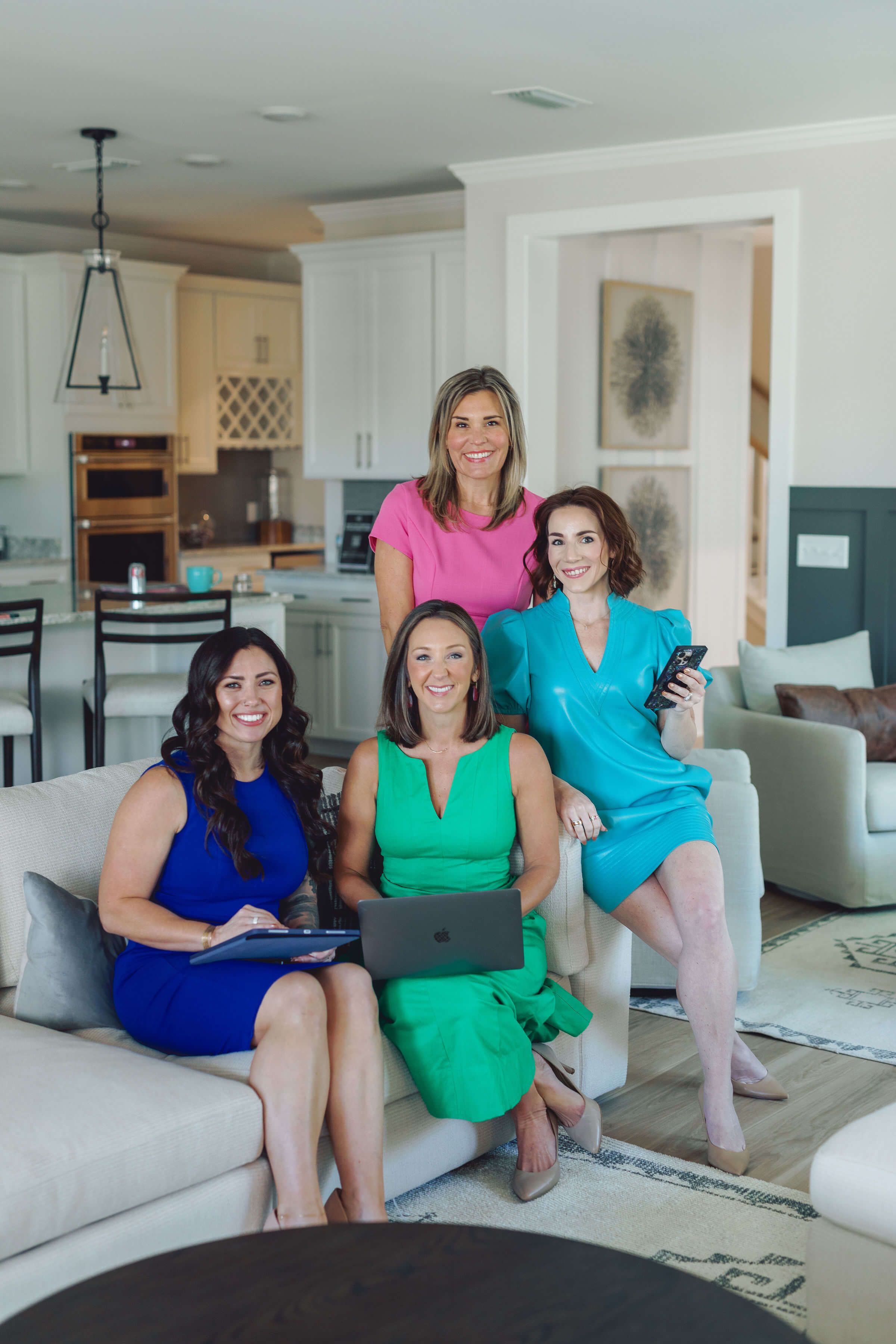 woman with glasses does paperwork by laptop