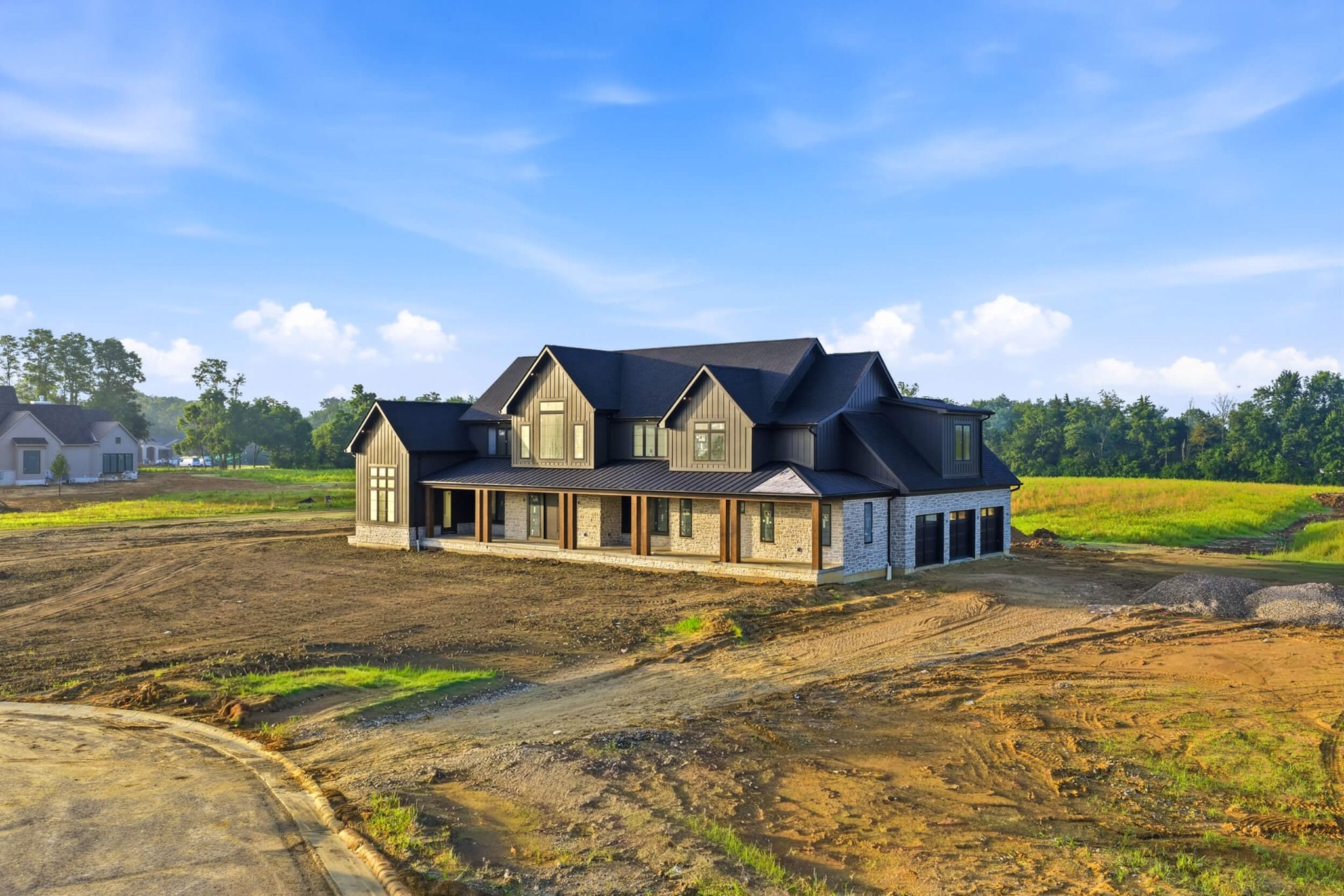Close angled view of the covered front porch and stone exterior