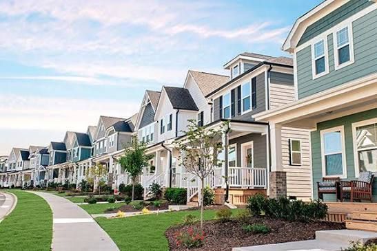 Modern homes in a walkable Wendell neighborhood featuring front porches, landscaped streets, and new construction homes.