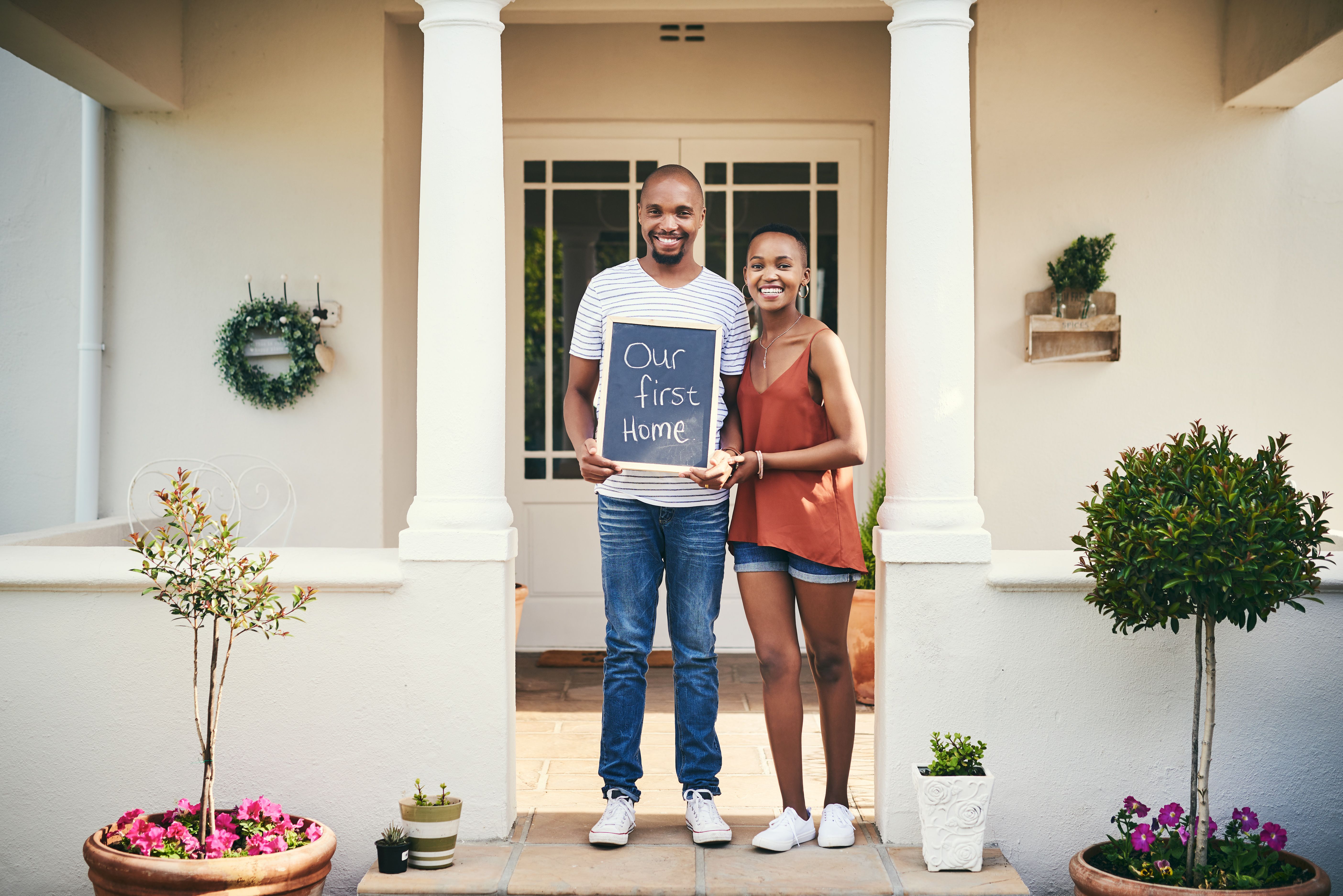 Couple holds sign