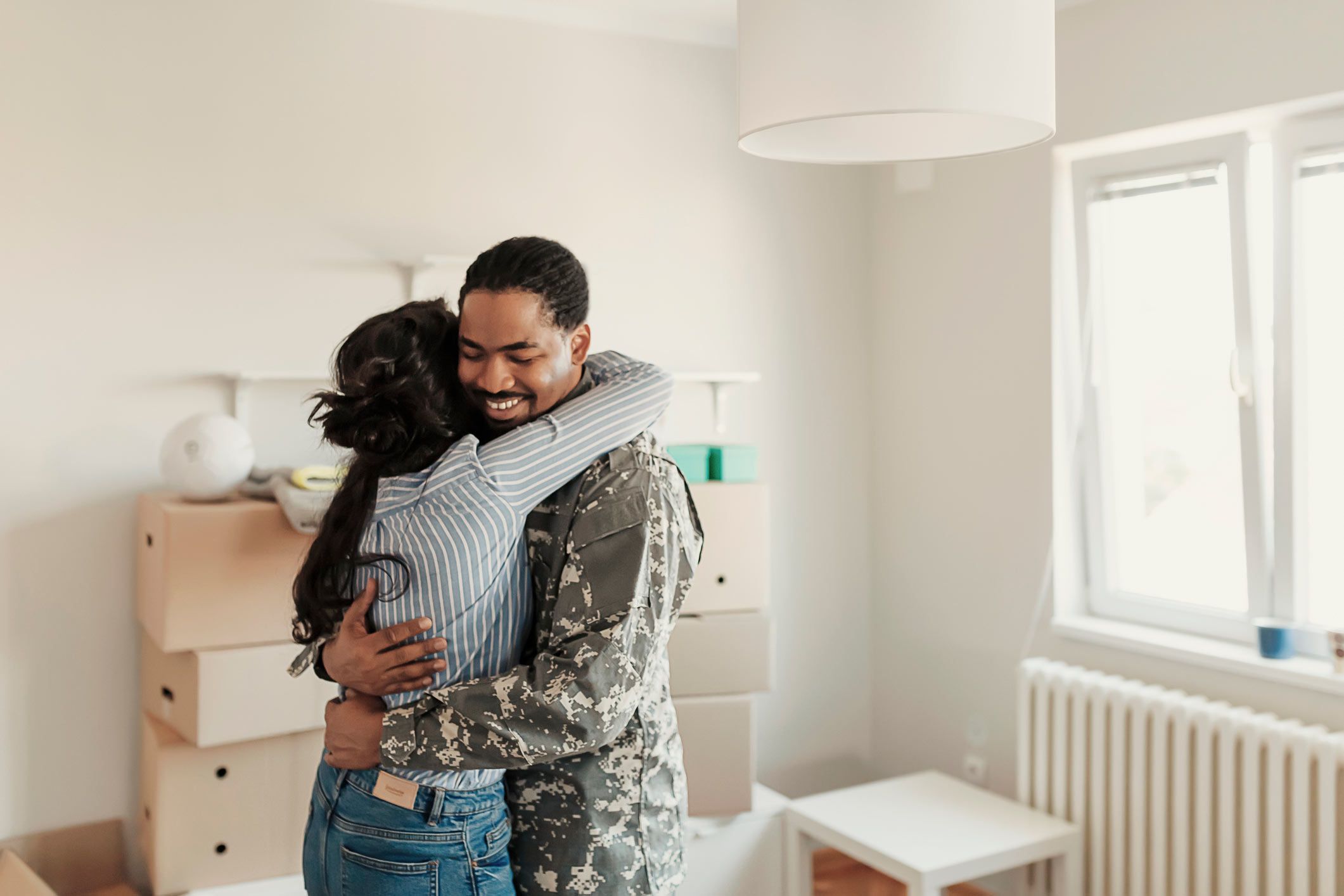 Couple cuddles on couch