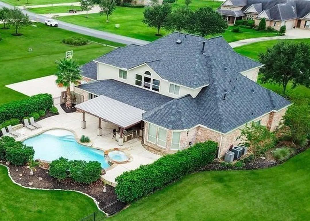 Pool and rear exterior of 3519 Lakes Of Katy Ln