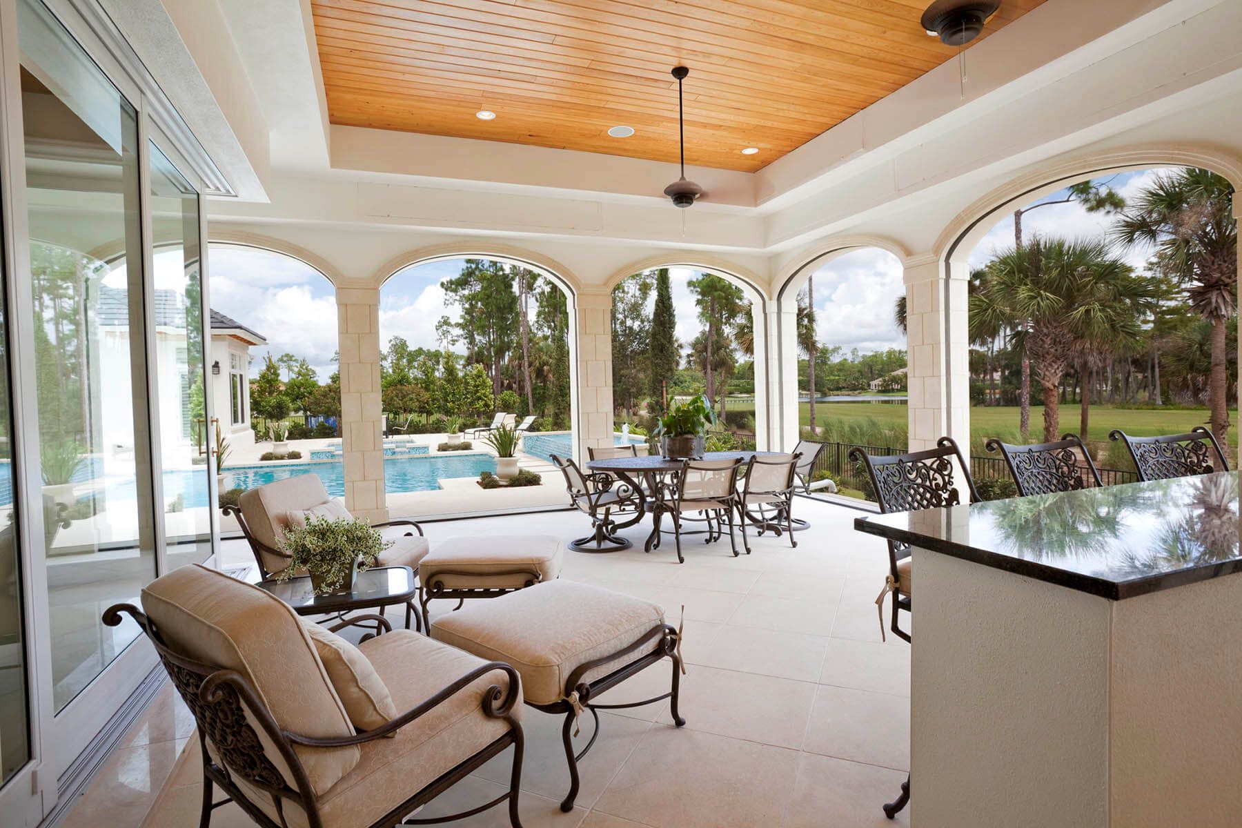 Back patio with pool on golf course