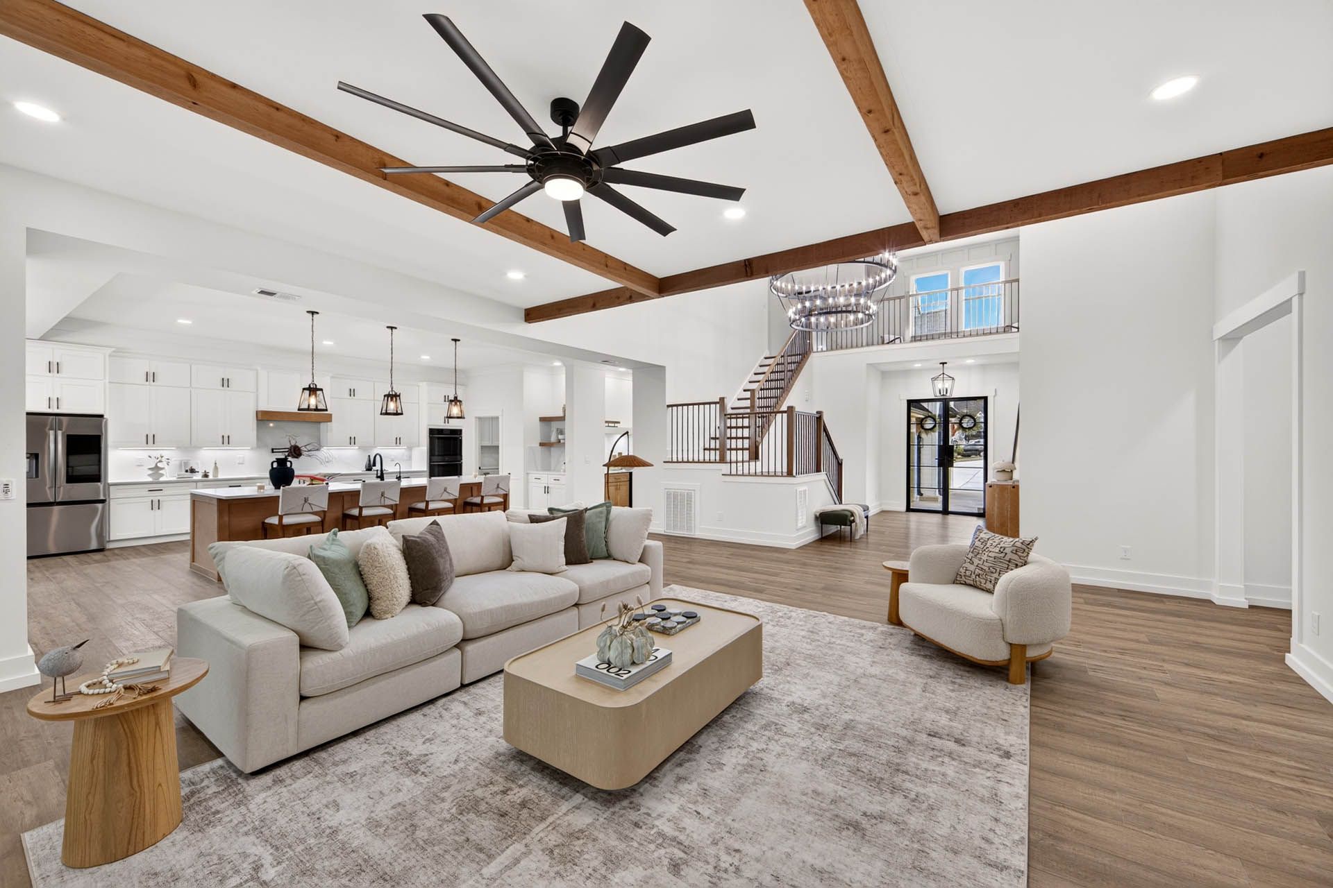 Open-concept great room, kitchen, and staircase