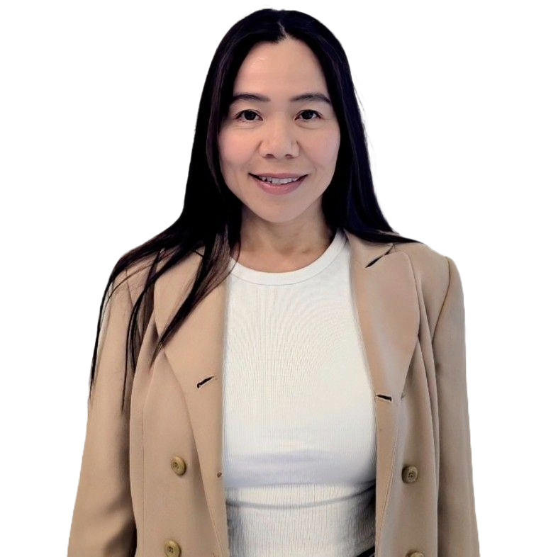 Smiling woman with long black hair wearing a beige blazer over a white top, isolated against a black background.