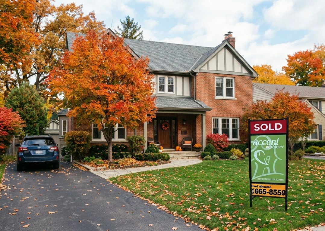 Sell your Tulsa home in fall with cozy curb appeal like these autumn trees around a beautiful brick home.