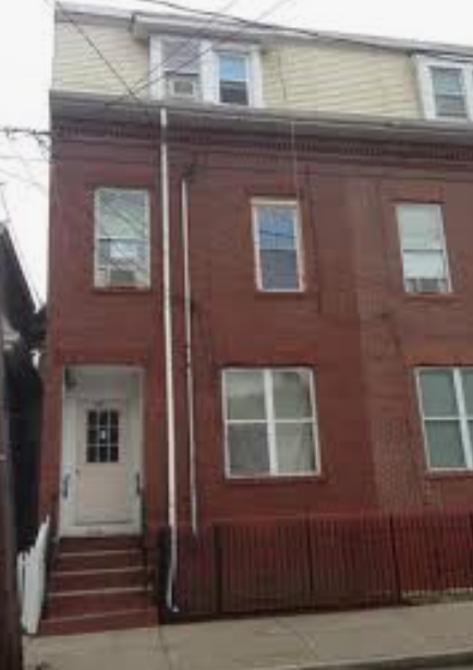 Brick three-family investment property in Chelsea, MA with three renovated units