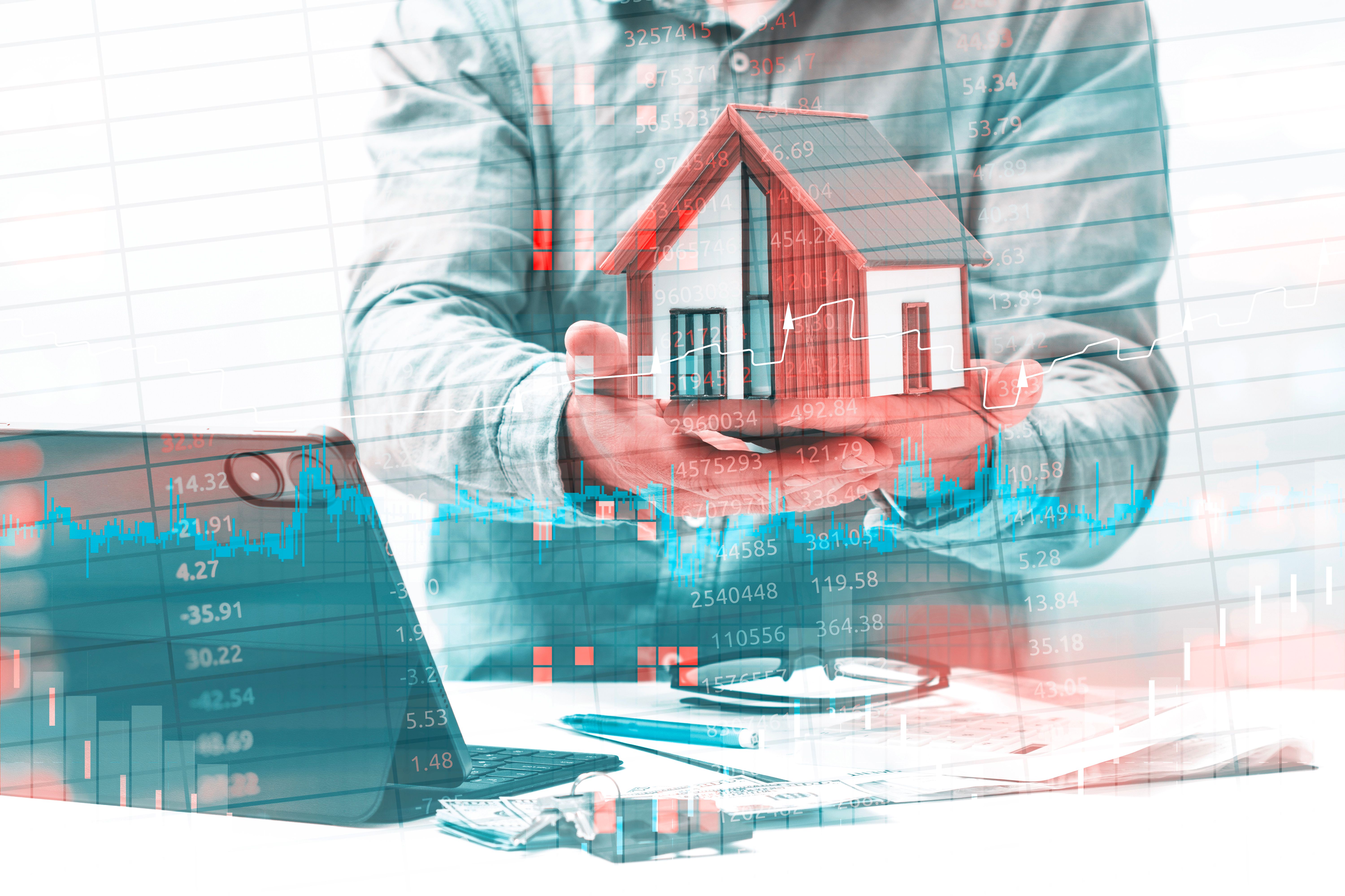 woman with glasses does paperwork by laptop