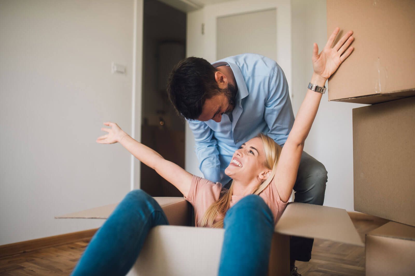 Couple cuddles on couch