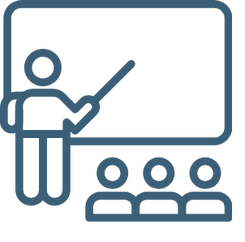 Teacher giving a lesson to students in a classroom with a blackboard