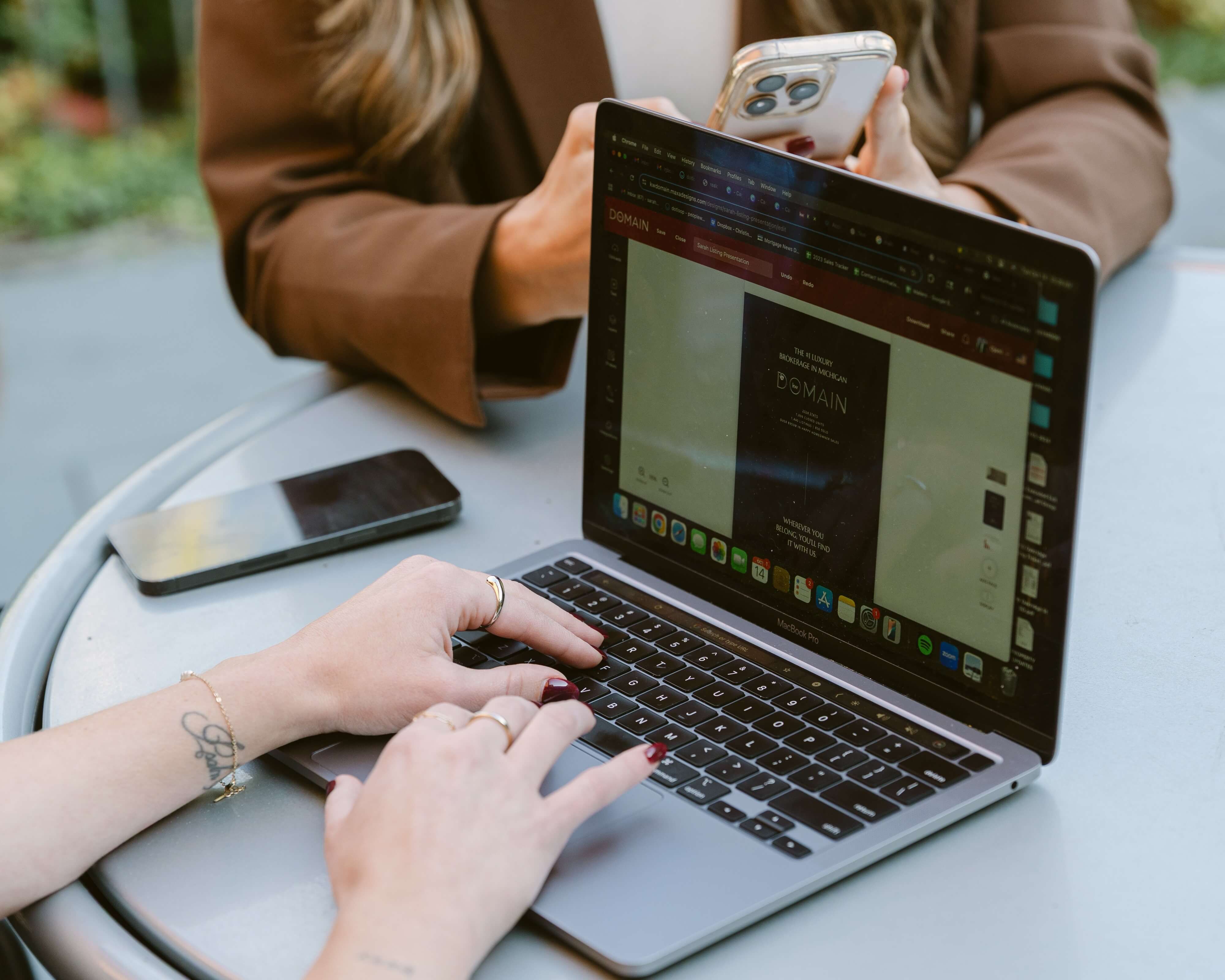 woman with glasses does paperwork by laptop