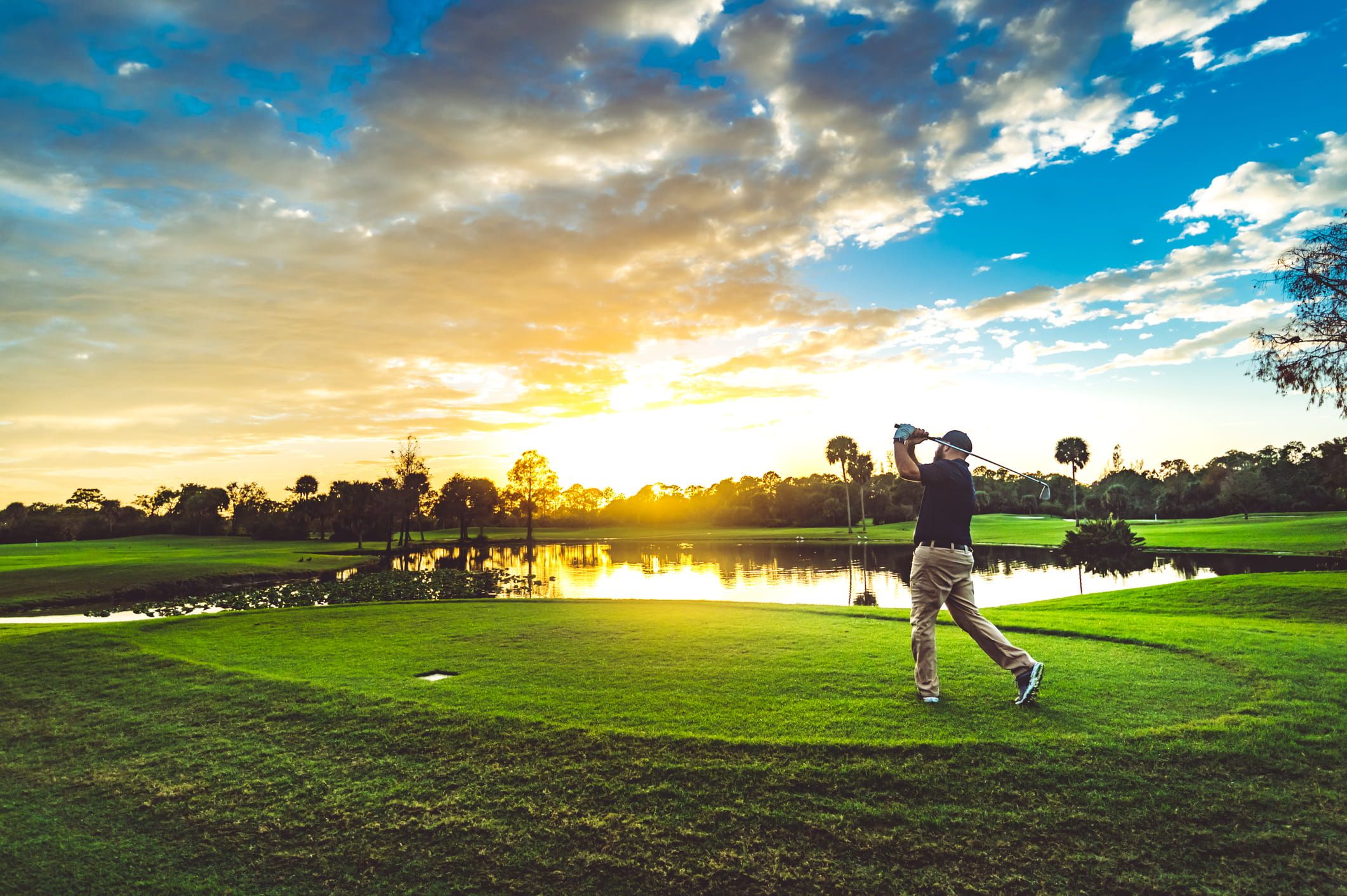 golfing at sunset
