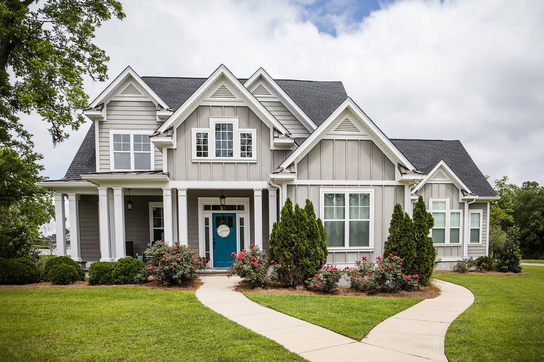 Craftsman-style home with a landscaped front walkway