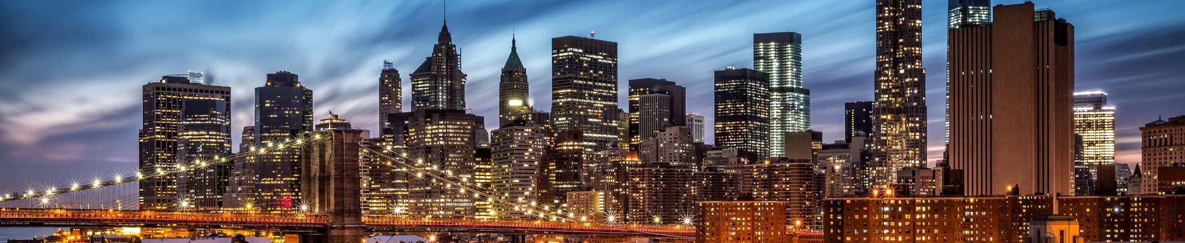 Lower Manhattan and the Brooklyn Bridge at dusk