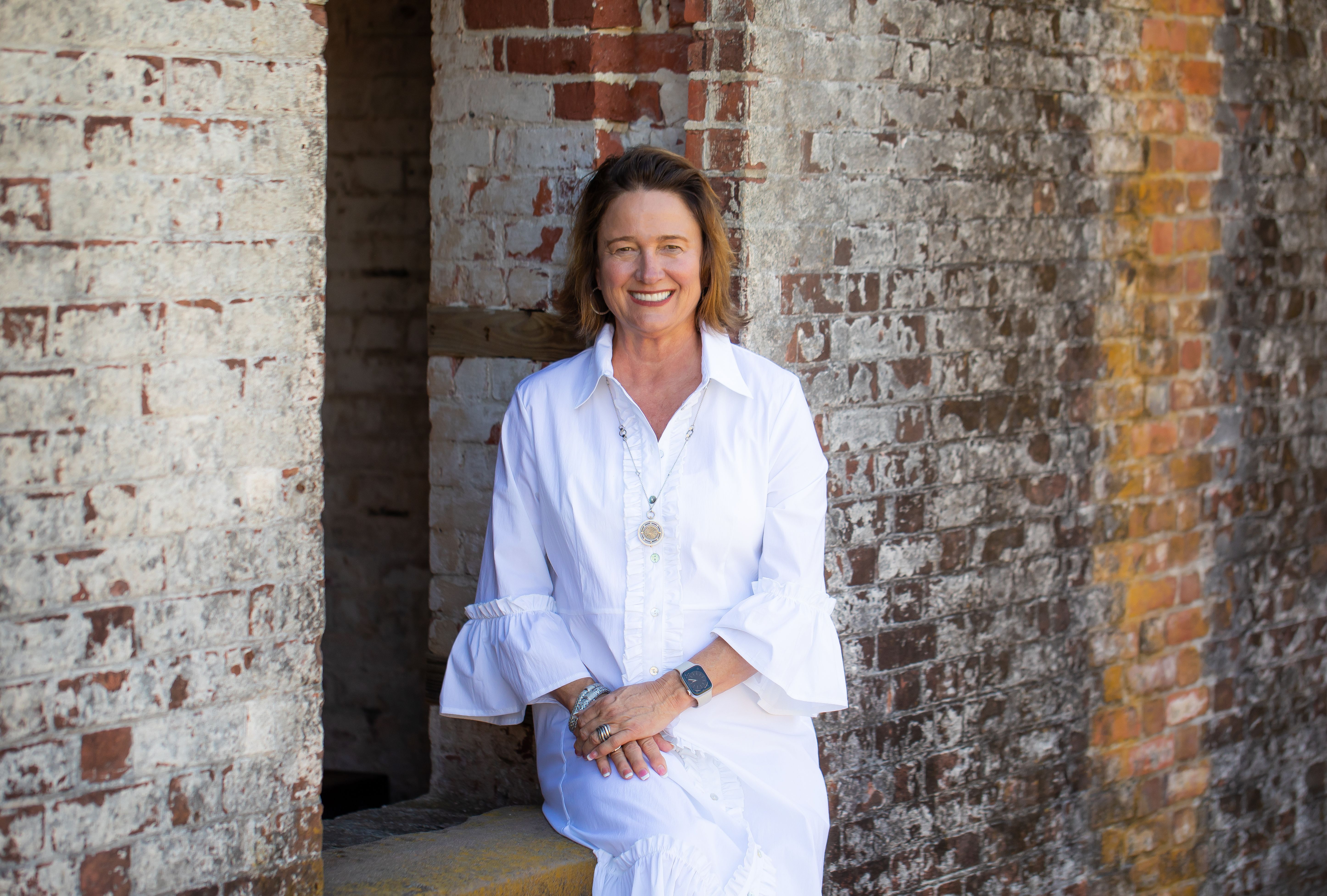 Photo of Sharon Garner outside wearing a blue blazer and white blouse 