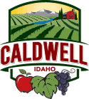 Caldwell Idaho city logo featuring farmland, a barn, and cherries representing local agriculture and community.
