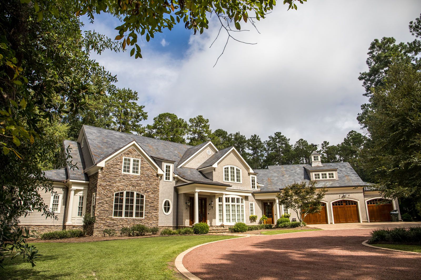 Large home exterior with circular driveway in Idaho