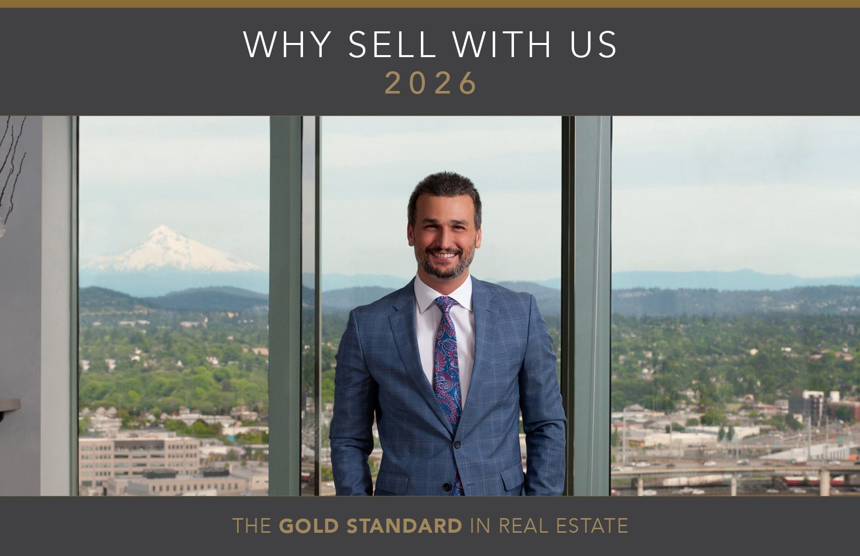 Professional man in a suit smiling in an office with a city and mountain view, promoting real estate services in 2026 with the slogan 