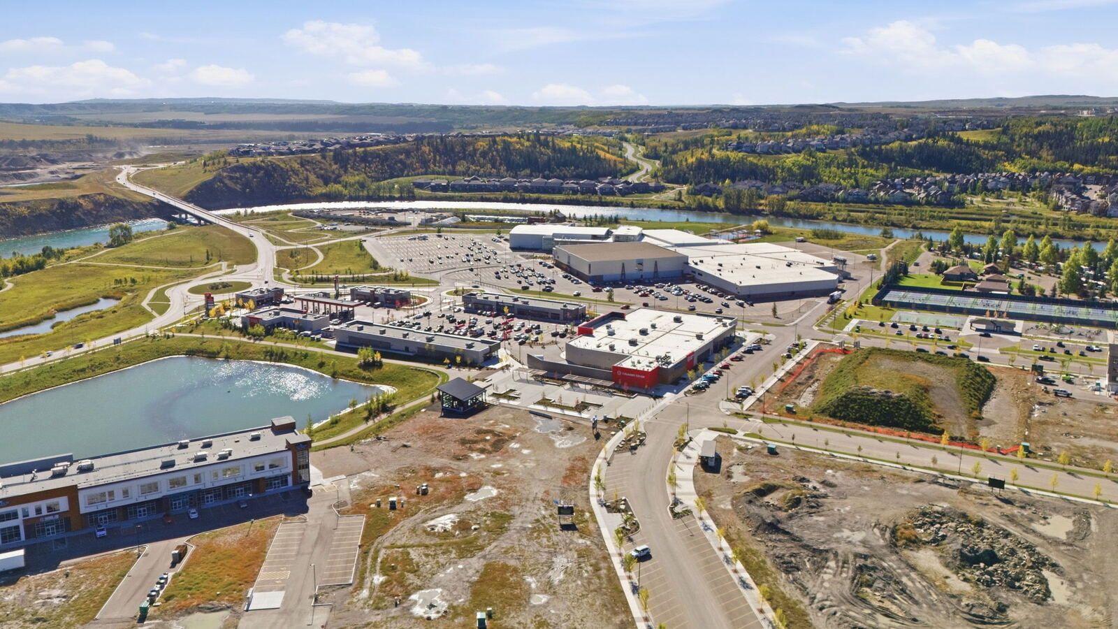 Aerial of the Bow River and nearby Cochrane shopping