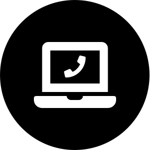 Laptop computer with a phone icon on the screen representing online communication or tech support