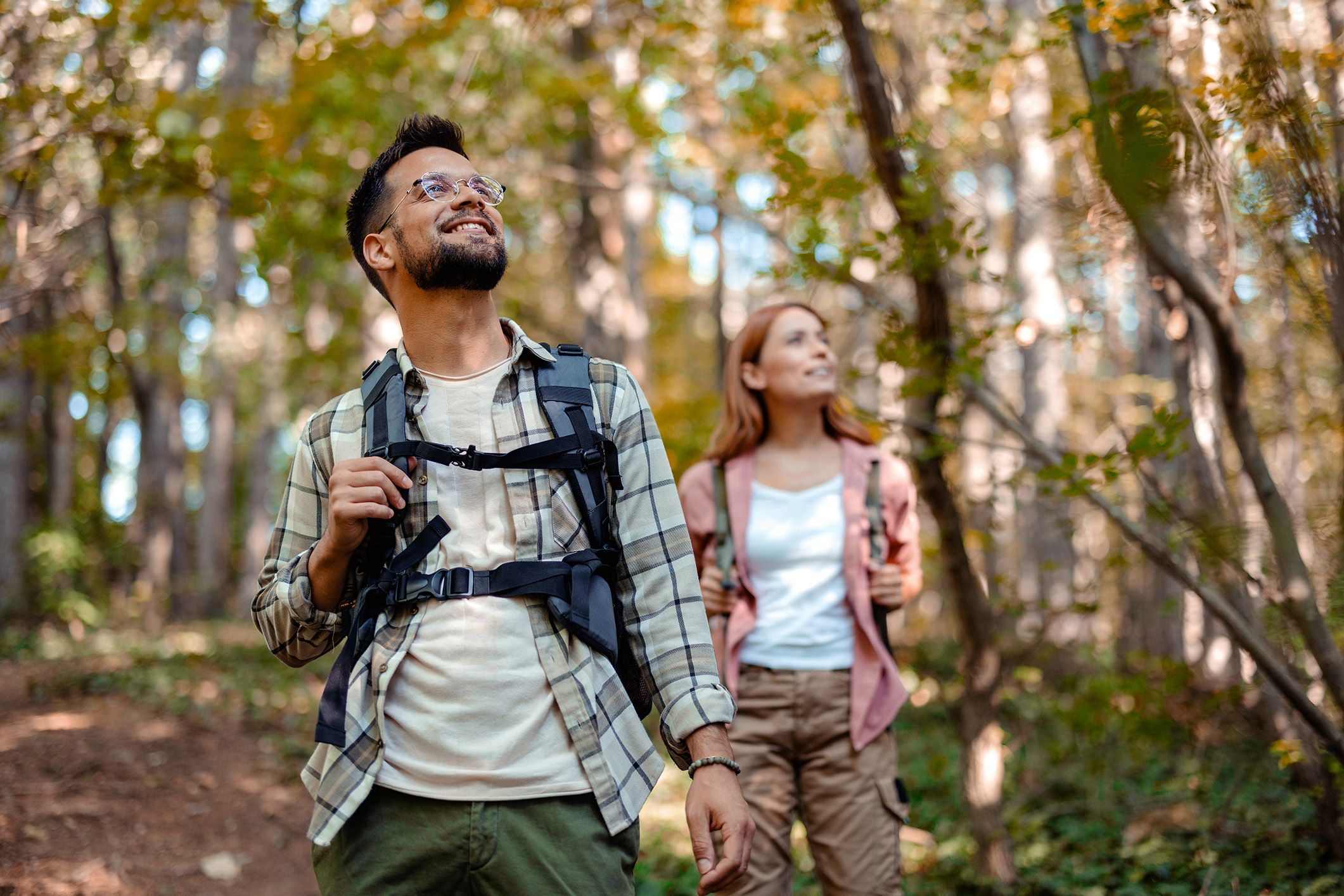 Couple hiking through forest