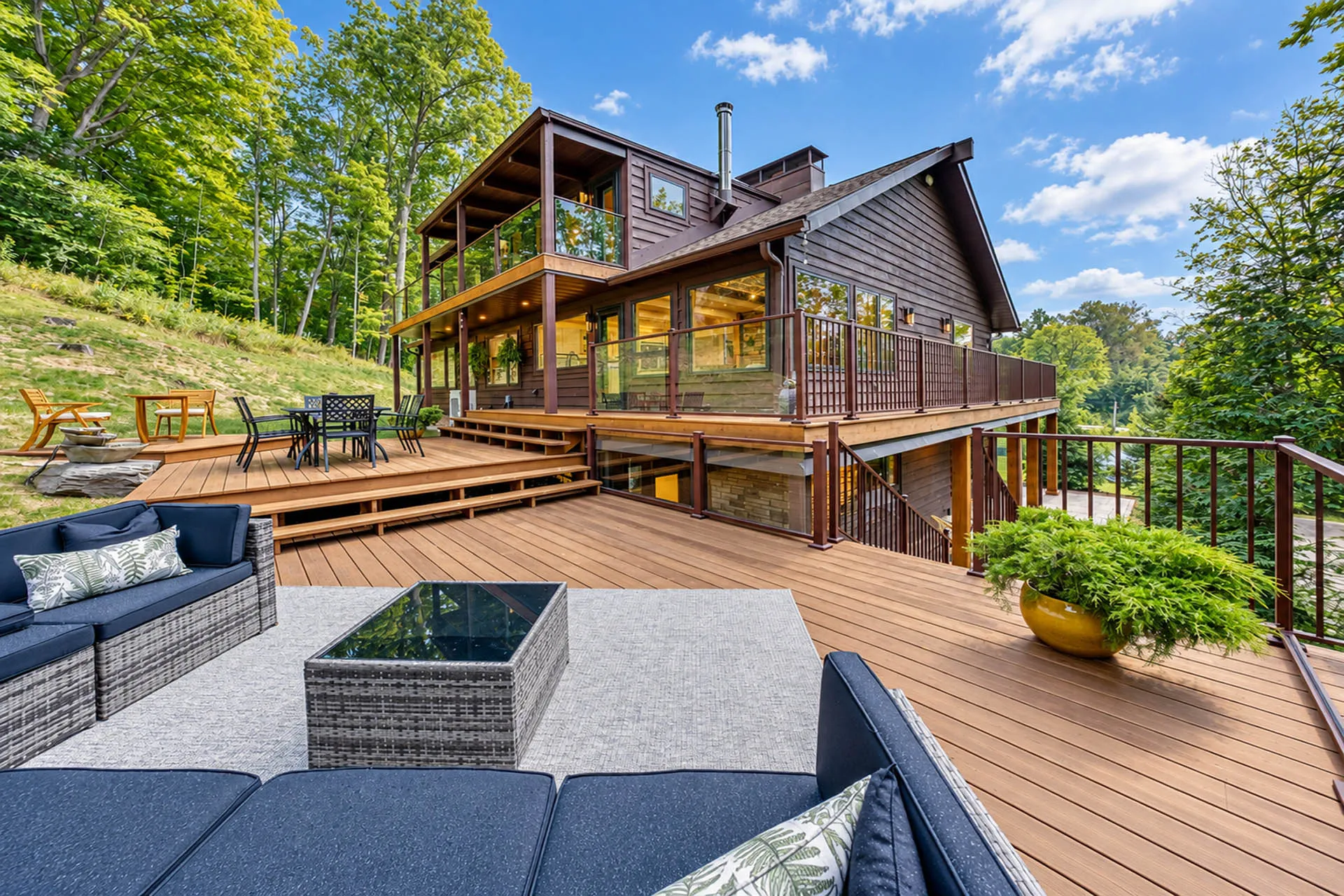 Elevated outdoor deck and patio overlooking the wooded grounds at 6915 Eagle Rd