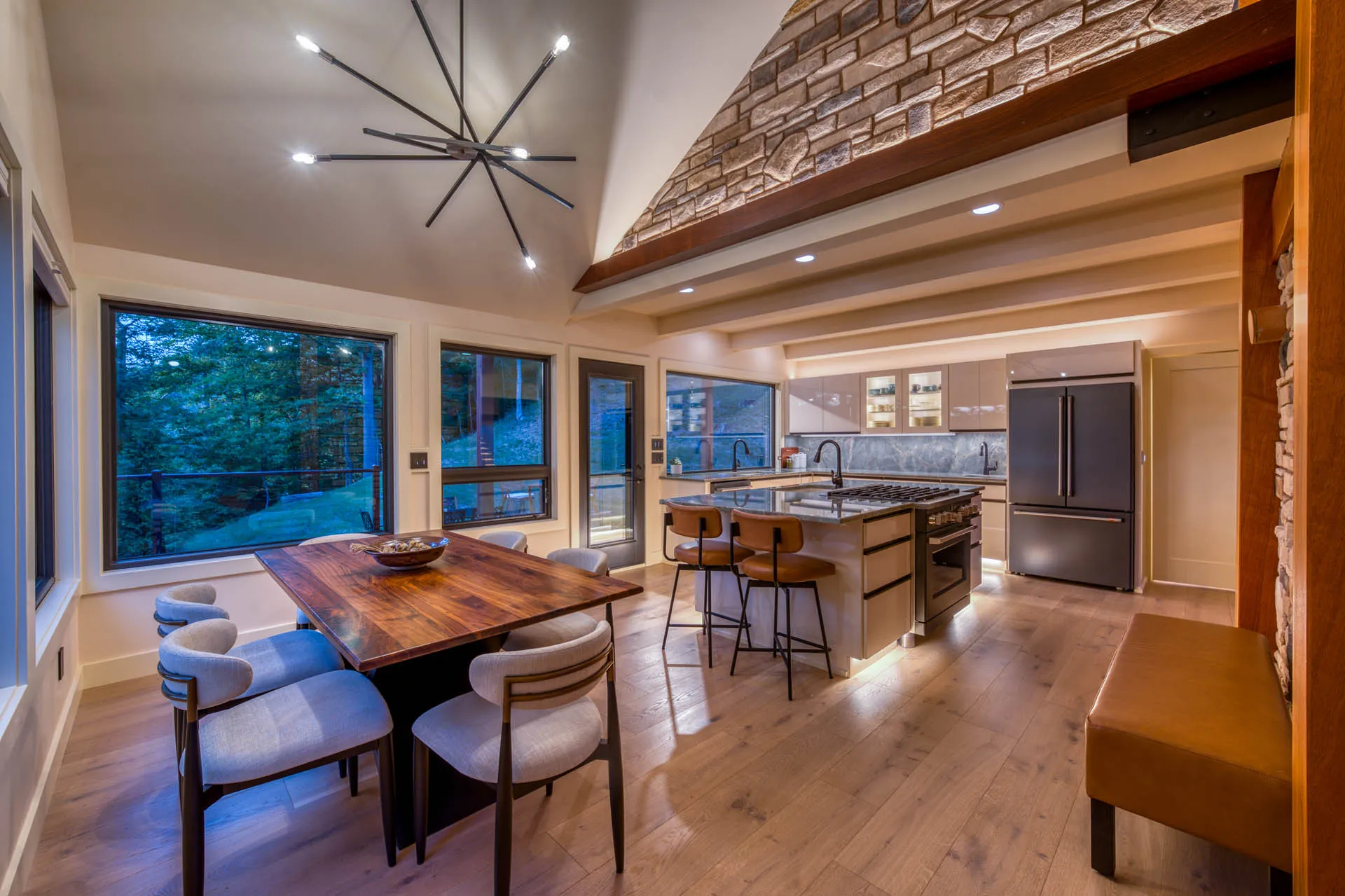 Bright open-concept kitchen and living area with large windows at 6915 Eagle Rd