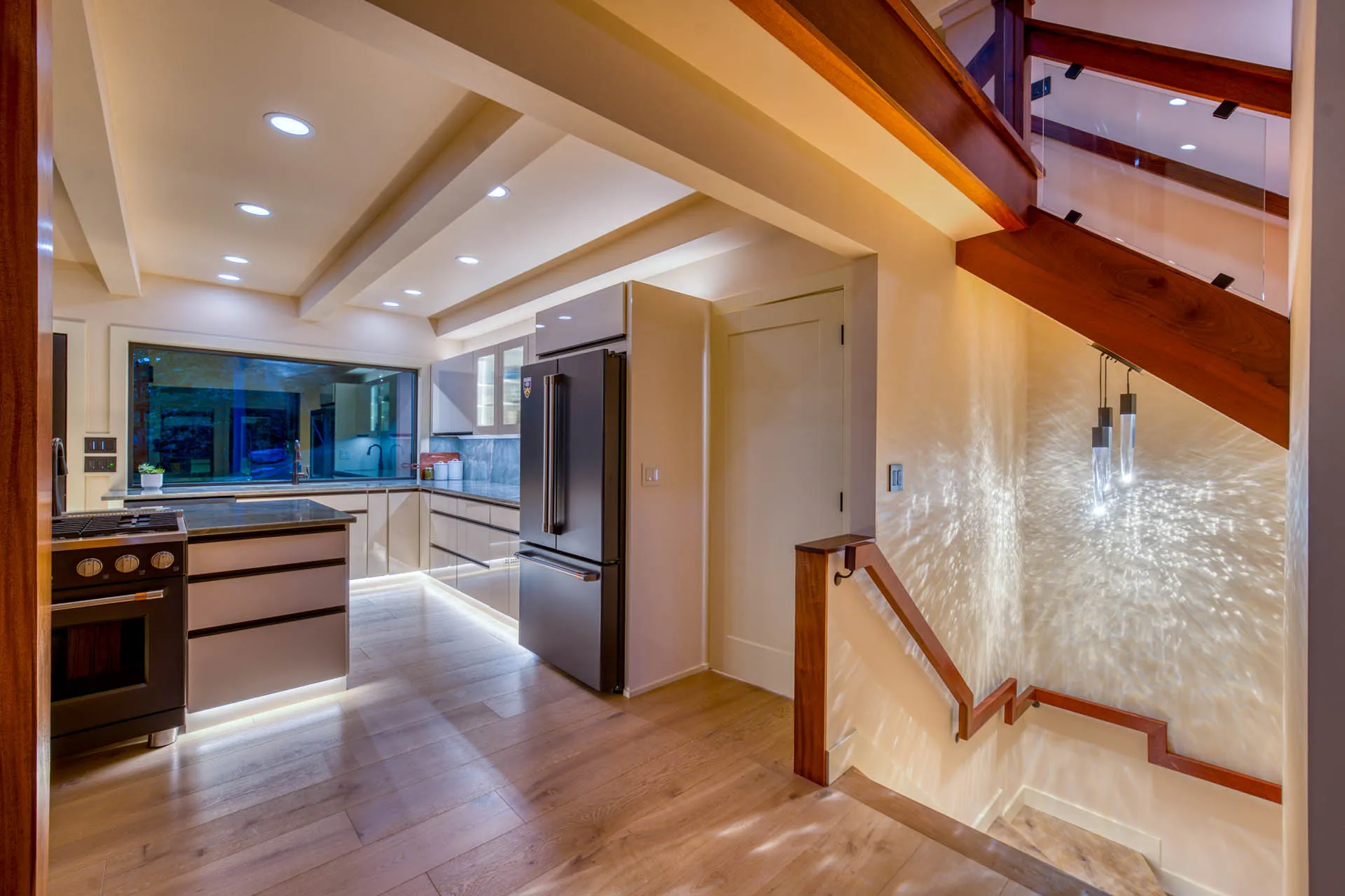 Kitchen hallway with wood flooring and stainless-steel refrigerator at 6915 Eagle Rd