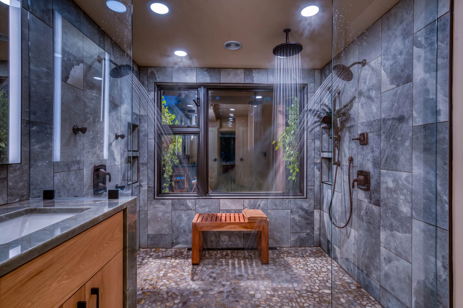 Spa-inspired bathroom with marble tile, soaking tub, and glass shower at 6915 Eagle Rd
