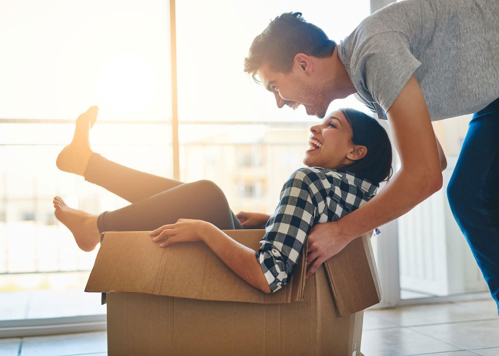 Couple cuddles on couch