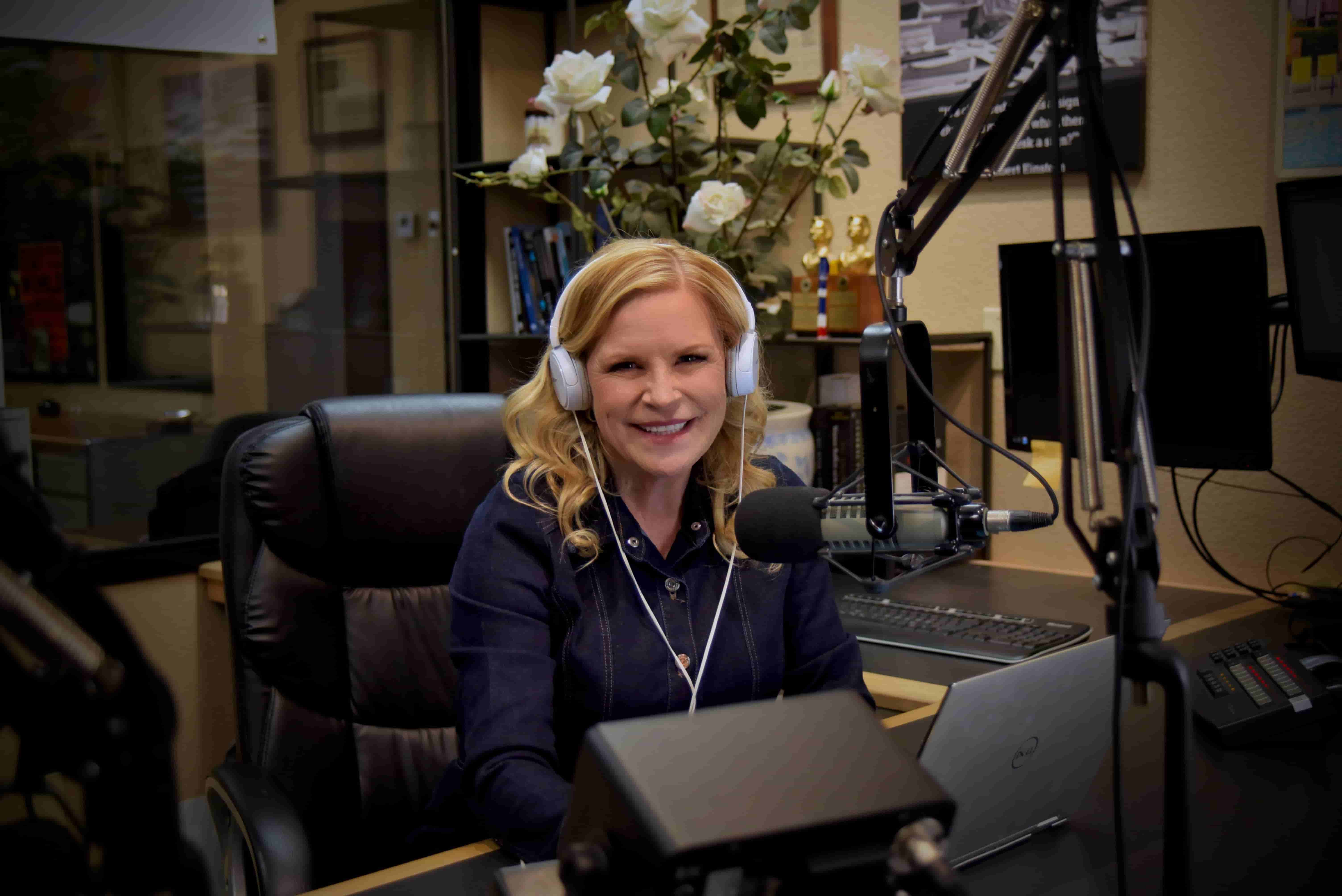 Laurie recording her podcast