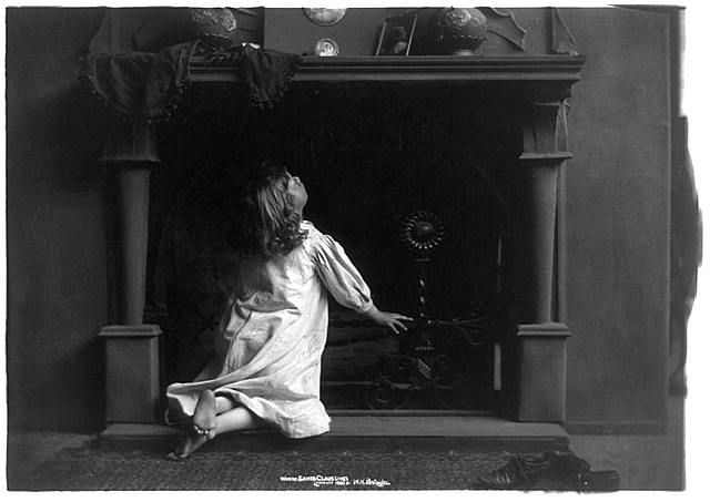 Little Girl Looking in Fireplace for Santa
