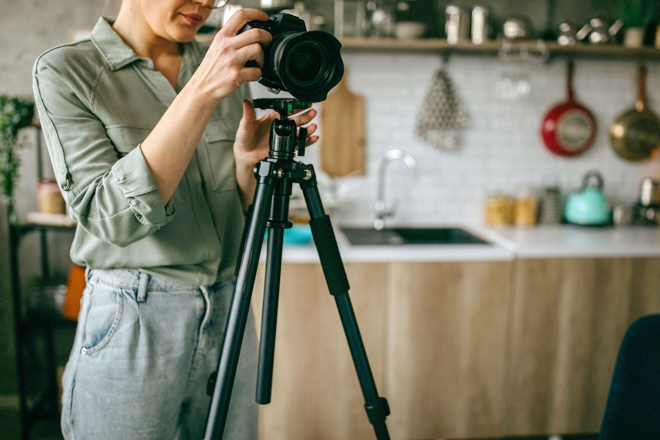 Woman Looks Down Camera In Home