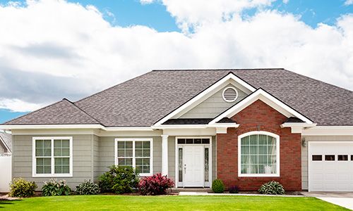 house with a green lawn